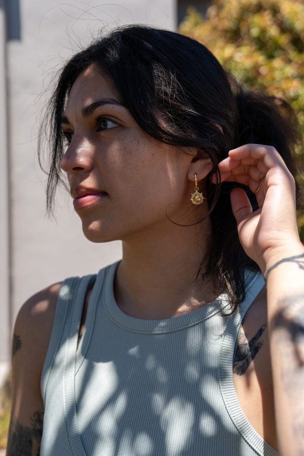 Beca wearing Koemi Studio pirate ship earrings